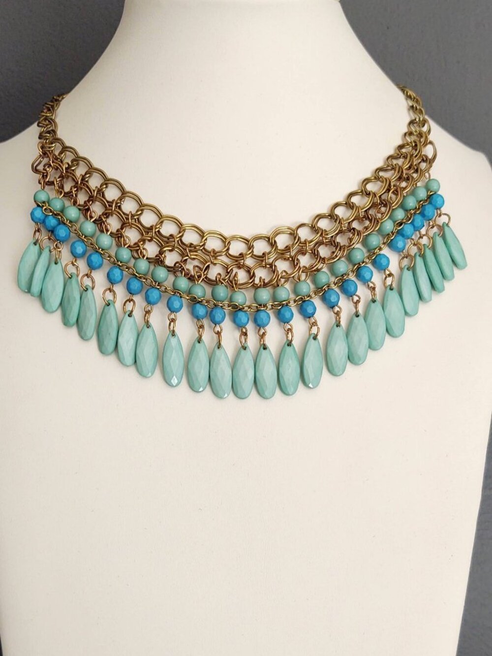 Blue and green beaded fringe necklace on gold chain